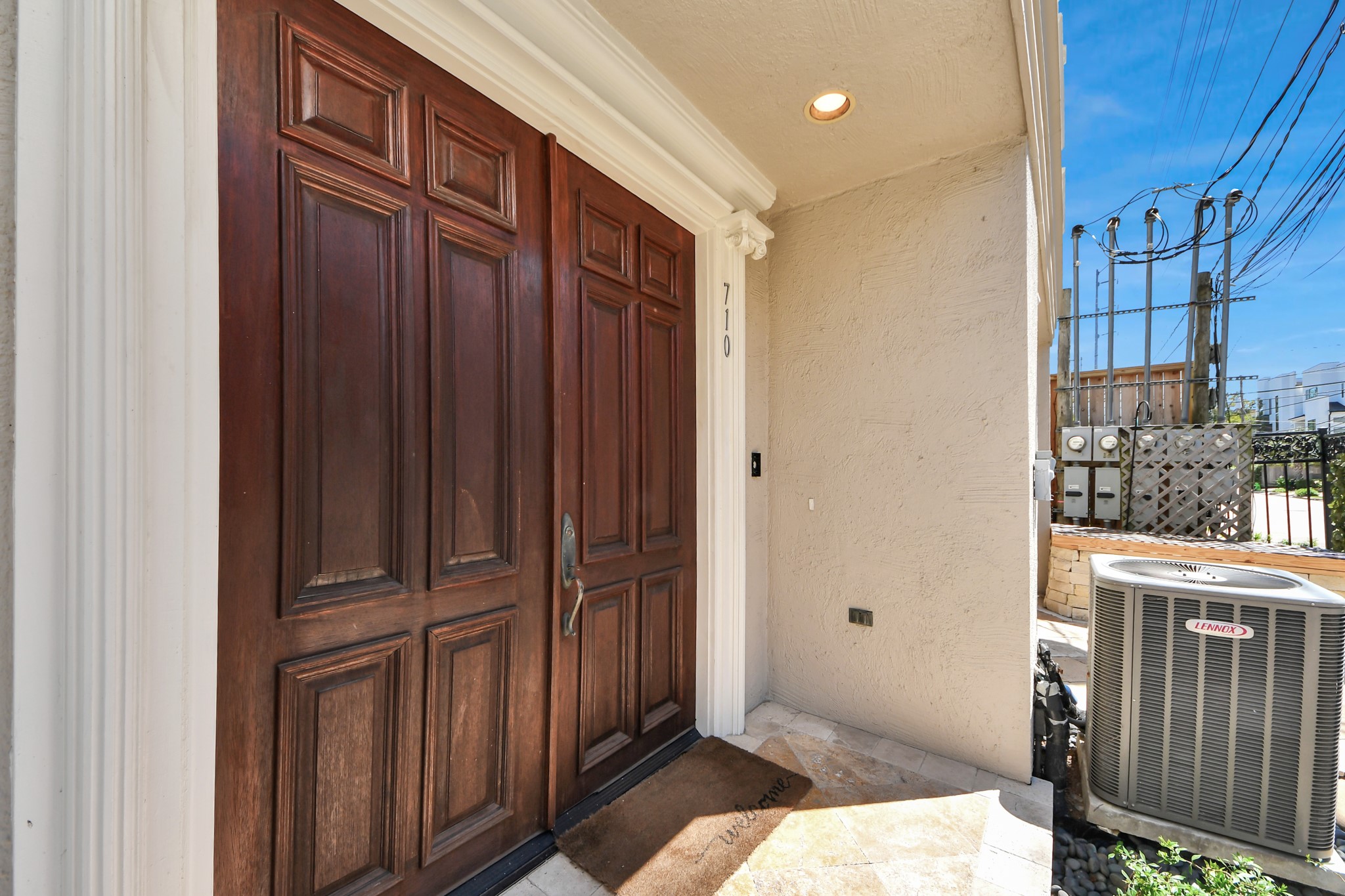 710 Jackson Hill Street Houston, TX 77007 - Photo 3 of 31 Home entrance with elegant double wooden doors, a covered porch with recessed lighting