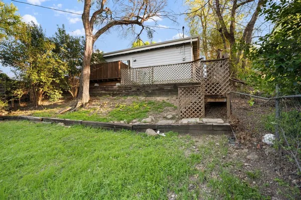 a view of a backyard of the house