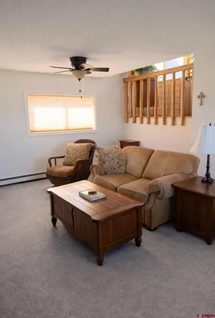 a living room with furniture and window