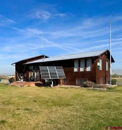 a view of house with yard