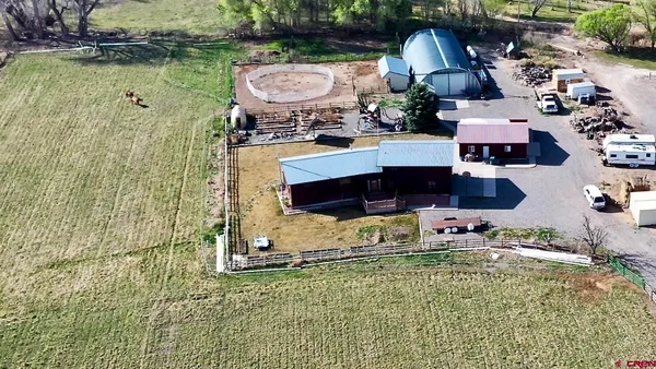 a view of swimming pool with outdoor seating and yard
