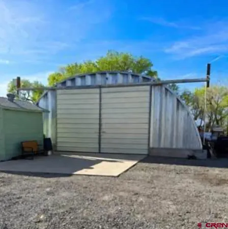 a view of a back yard of the house