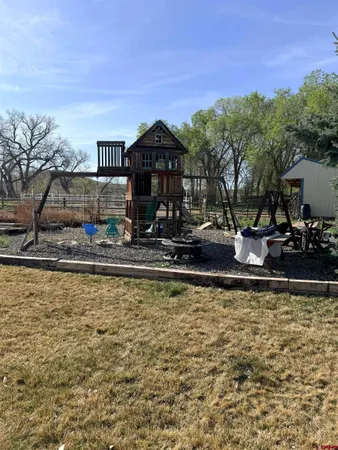 a view of a swimming pool with an outdoor seating
