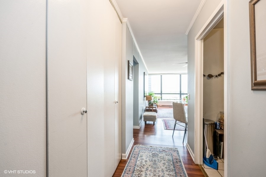 5415 North Sheridan Road, Unit 1015 Chicago, IL 60640 - Photo 2 of 10 a living room with furniture and a rug