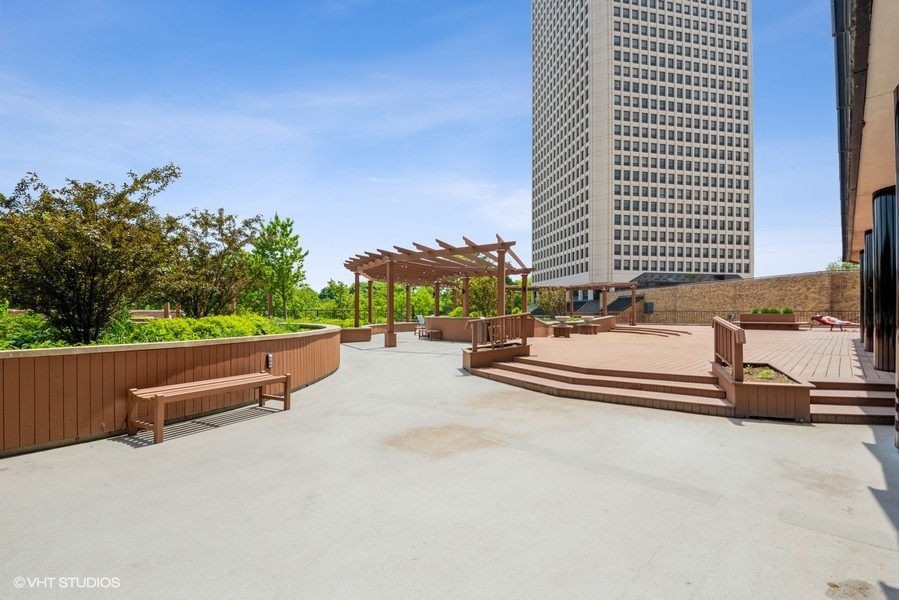 5415 North Sheridan Road, Unit 1015 Chicago, IL 60640 - Photo 10 of 10 a swimming pool with outdoor seating and yard