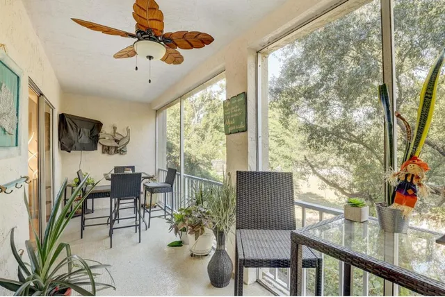 a view of a livingroom with furniture and a window
