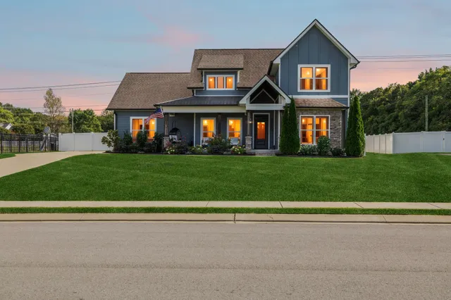 a front view of a house with a yard
