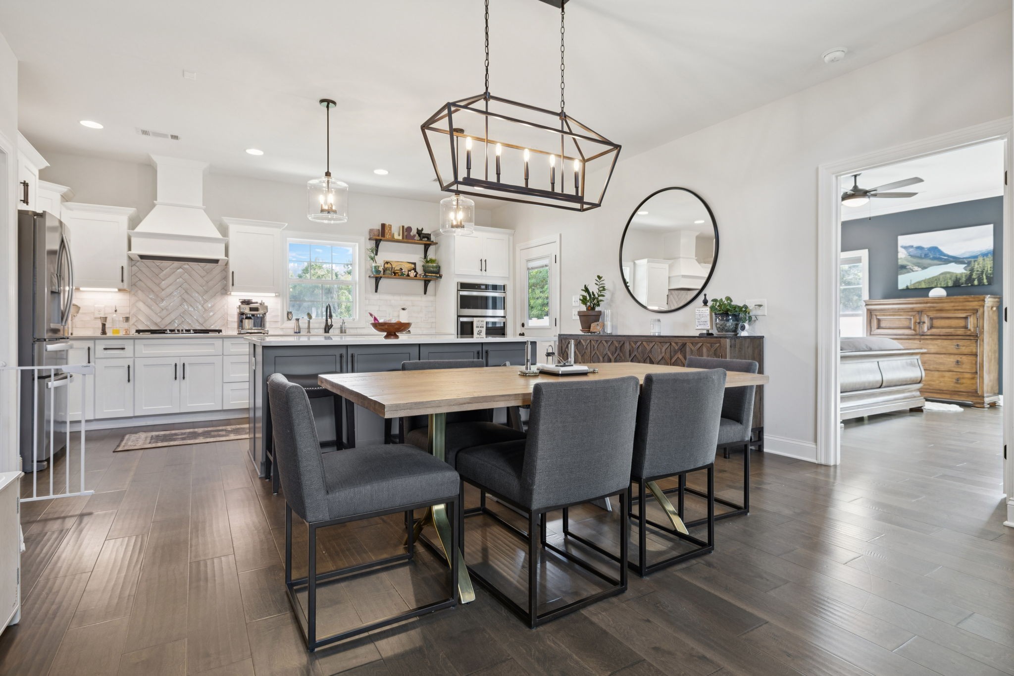 2022 Trout Trail Murfreesboro, TN 37129 - Photo 11 of 44 a dining room with wooden floor a chandelier a wooden table and chairs