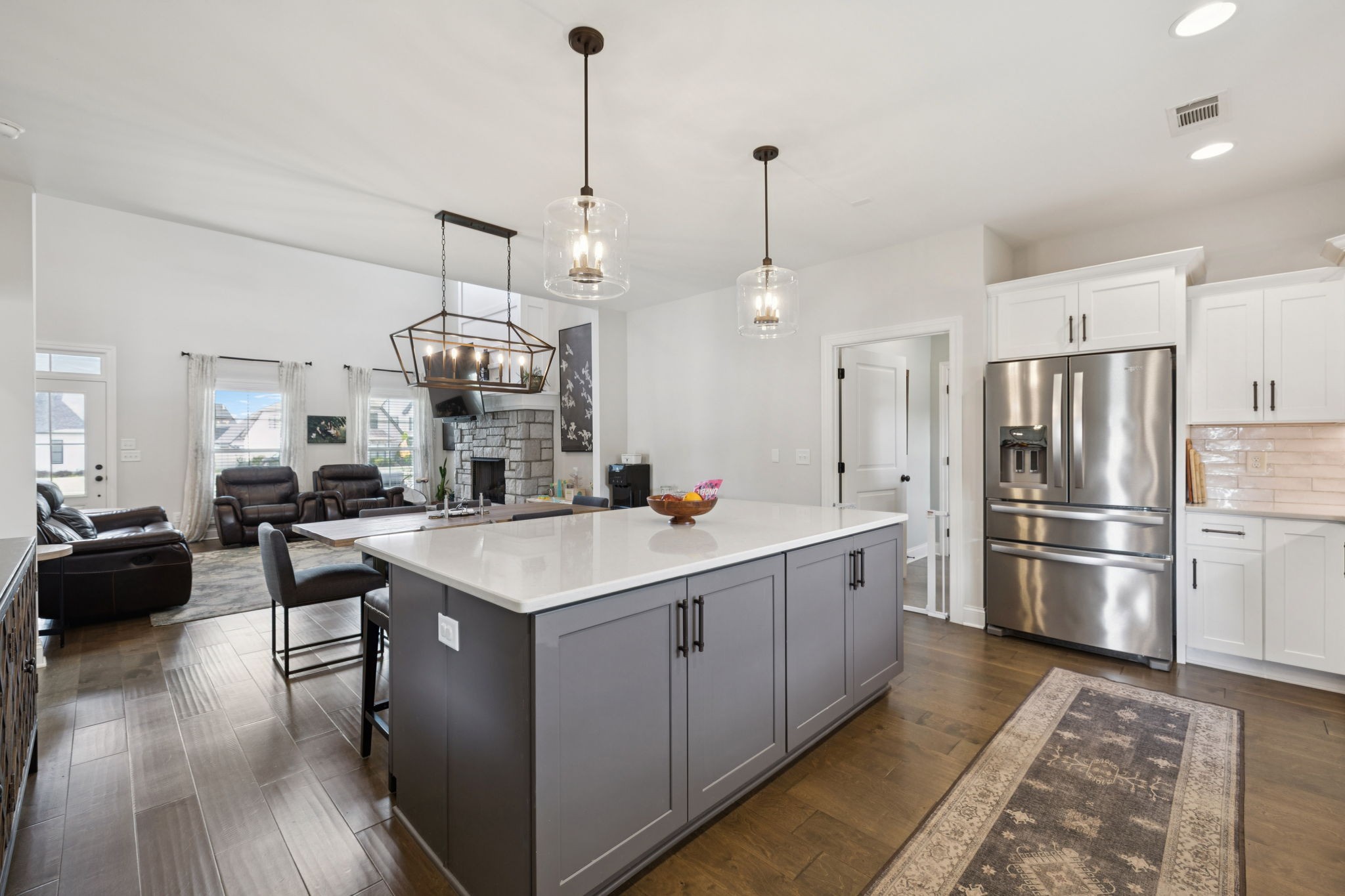 2022 Trout Trail Murfreesboro, TN 37129 - Photo 13 of 44 a kitchen with a refrigerator a sink dishwasher a oven and a dining table with wooden floor