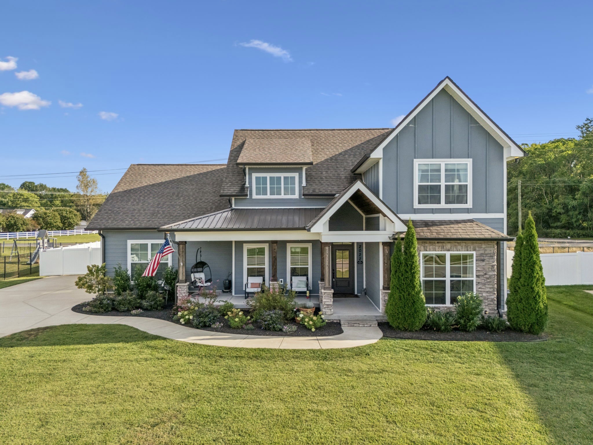 2022 Trout Trail Murfreesboro, TN 37129 - Photo 2 of 44 a front view of a house with swimming pool and porch