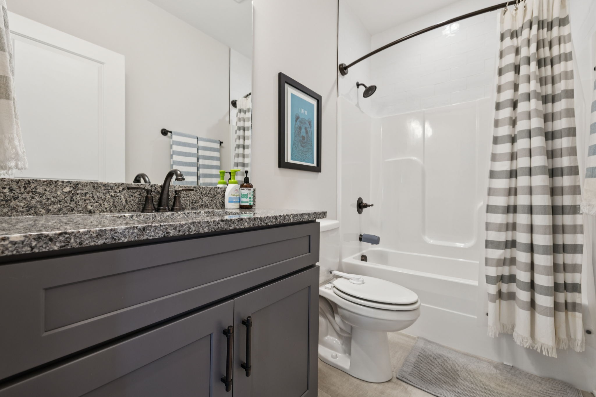 2022 Trout Trail Murfreesboro, TN 37129 - Photo 26 of 44 a bathroom with a granite countertop sink a toilet and shower
