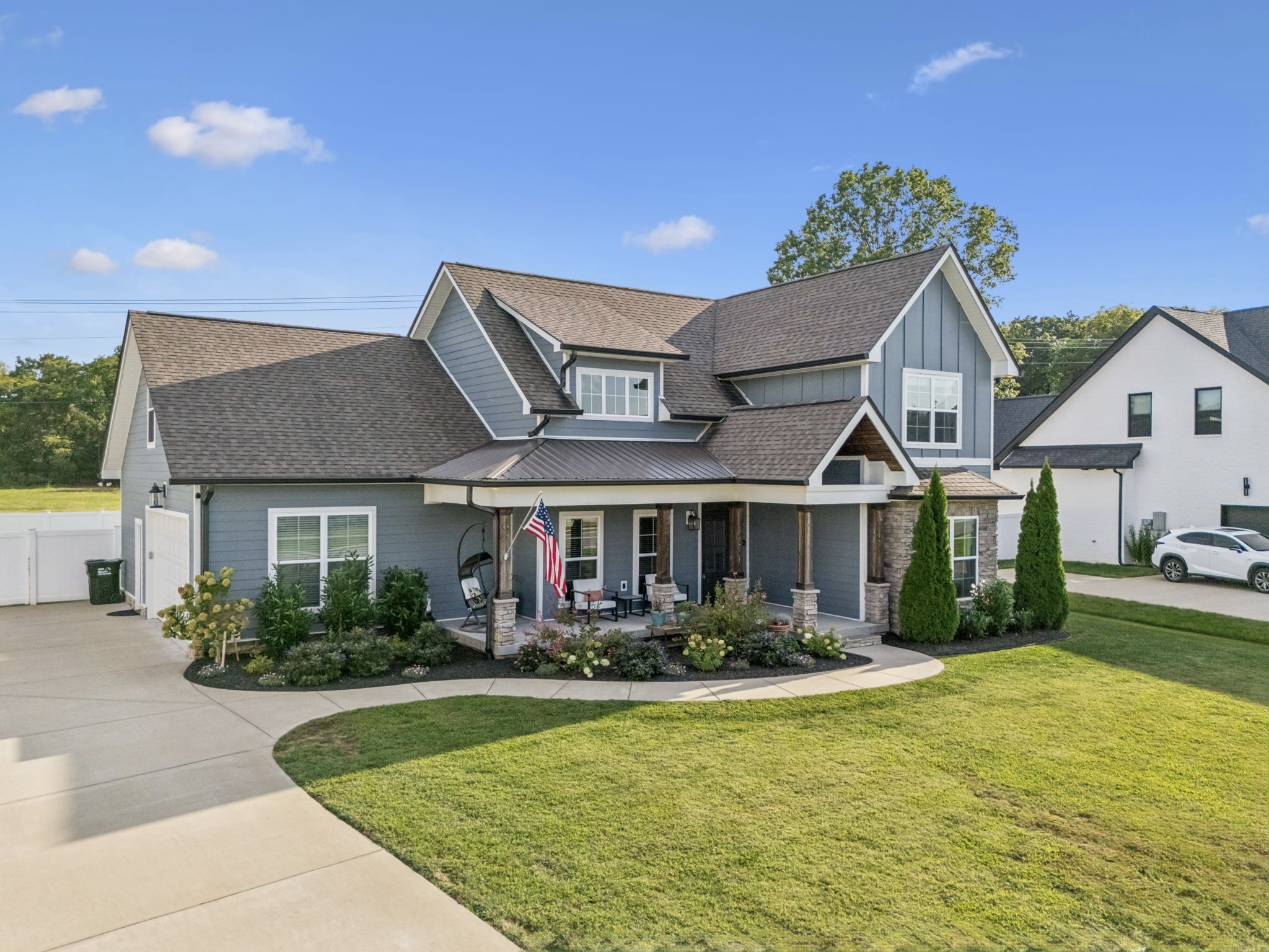 2022 Trout Trail Murfreesboro, TN 37129 - Photo 3 of 44 a front view of a house with porch yard and swimming pool