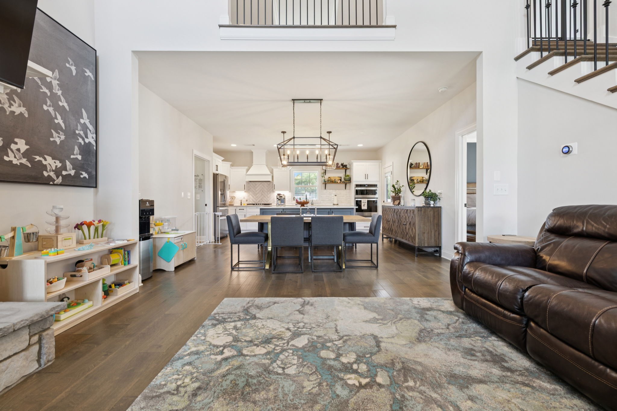 2022 Trout Trail Murfreesboro, TN 37129 - Photo 7 of 44 a living room with furniture a dining table and paintings on the wall