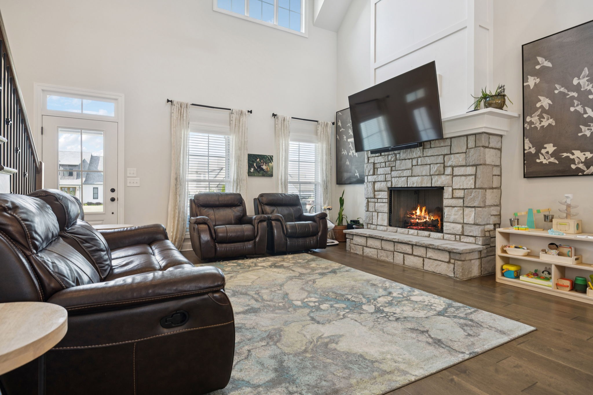 2022 Trout Trail Murfreesboro, TN 37129 - Photo 10 of 44 a living room with furniture a flat screen tv and a fireplace