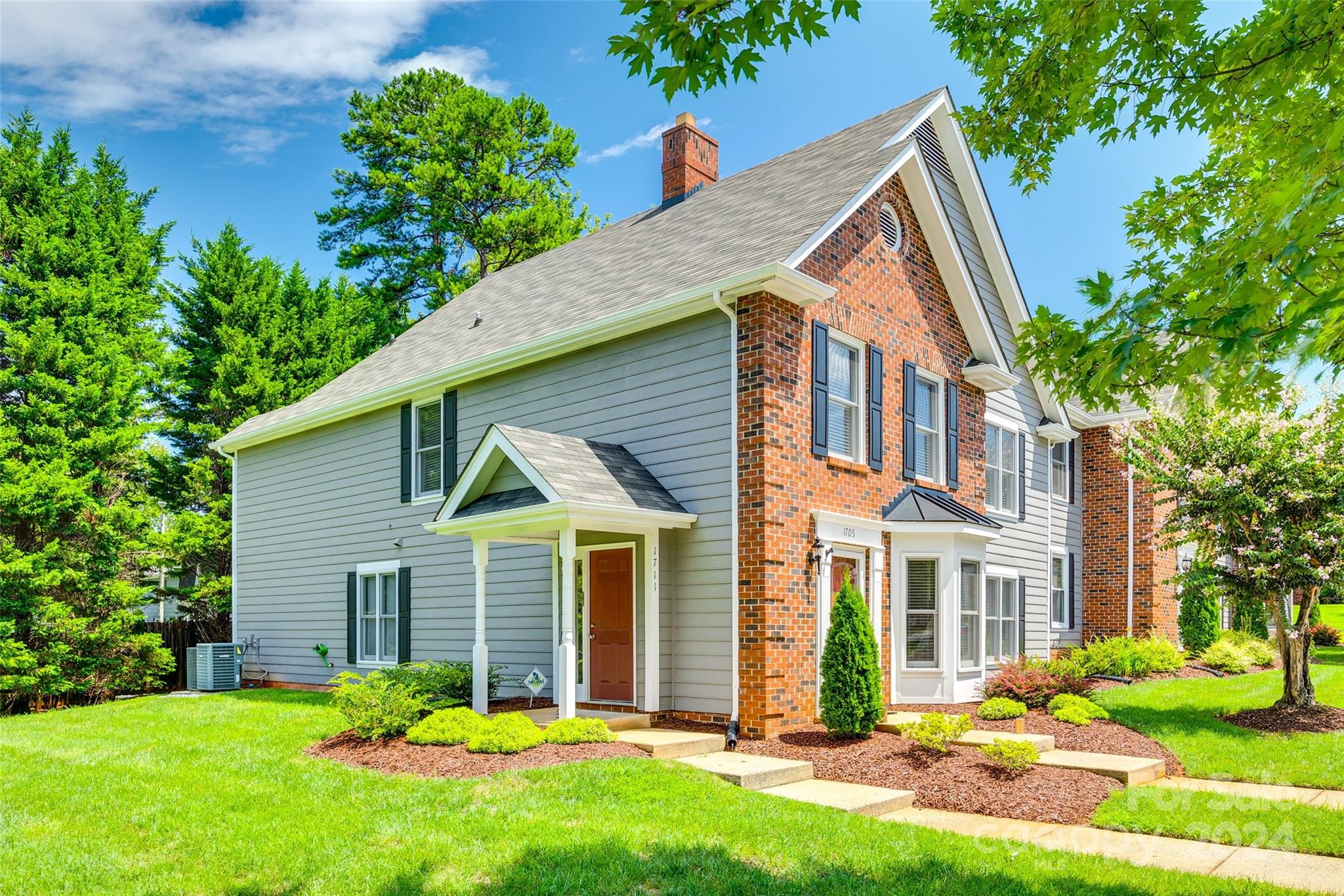 1711 Robinwood Road Gastonia, NC 28054 - Photo 1 of 25 a view of a house with a yard