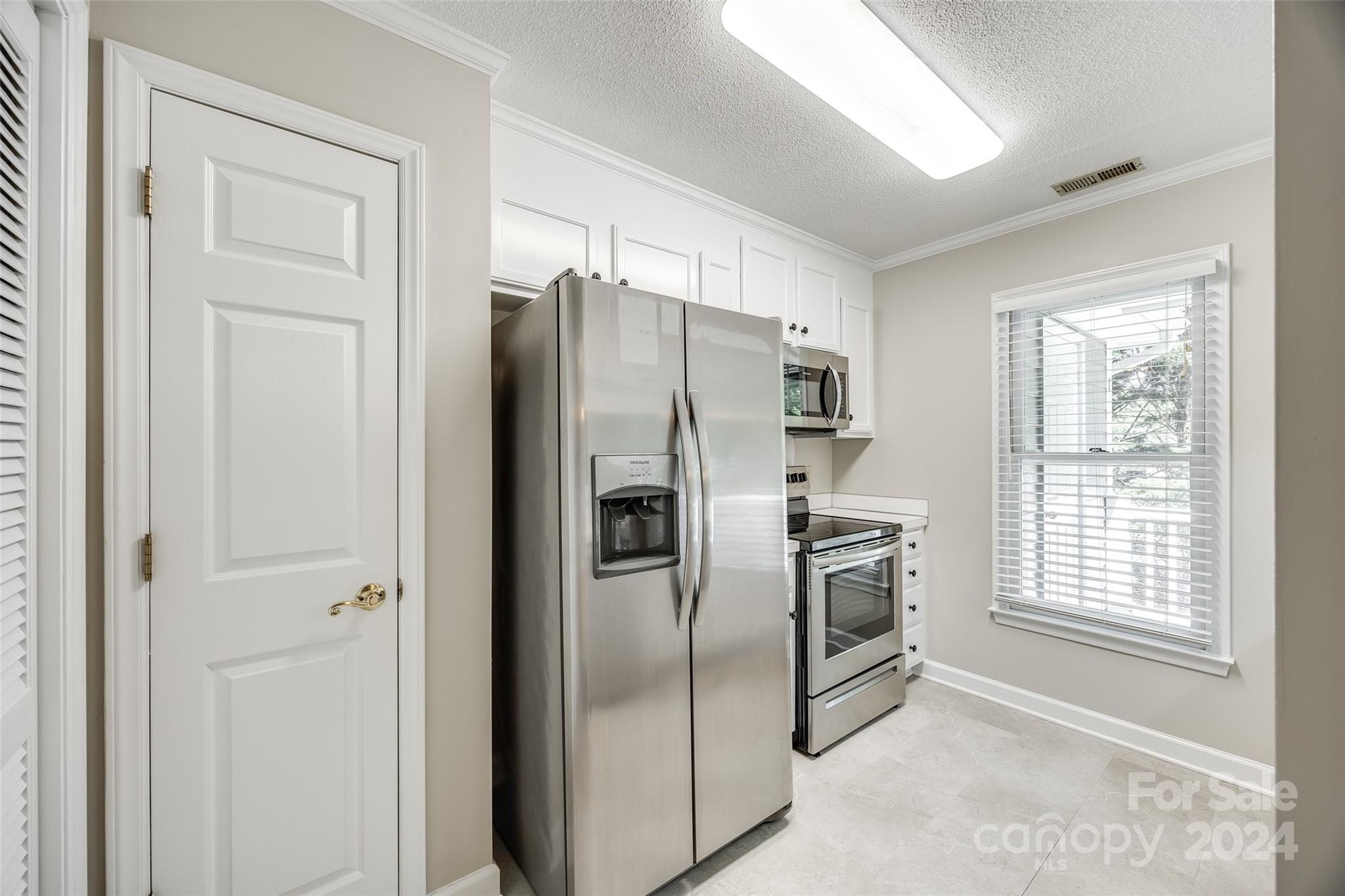 1711 Robinwood Road Gastonia, NC 28054 - Photo 12 of 25 a kitchen with stainless steel appliances granite countertop a refrigerator and a sink