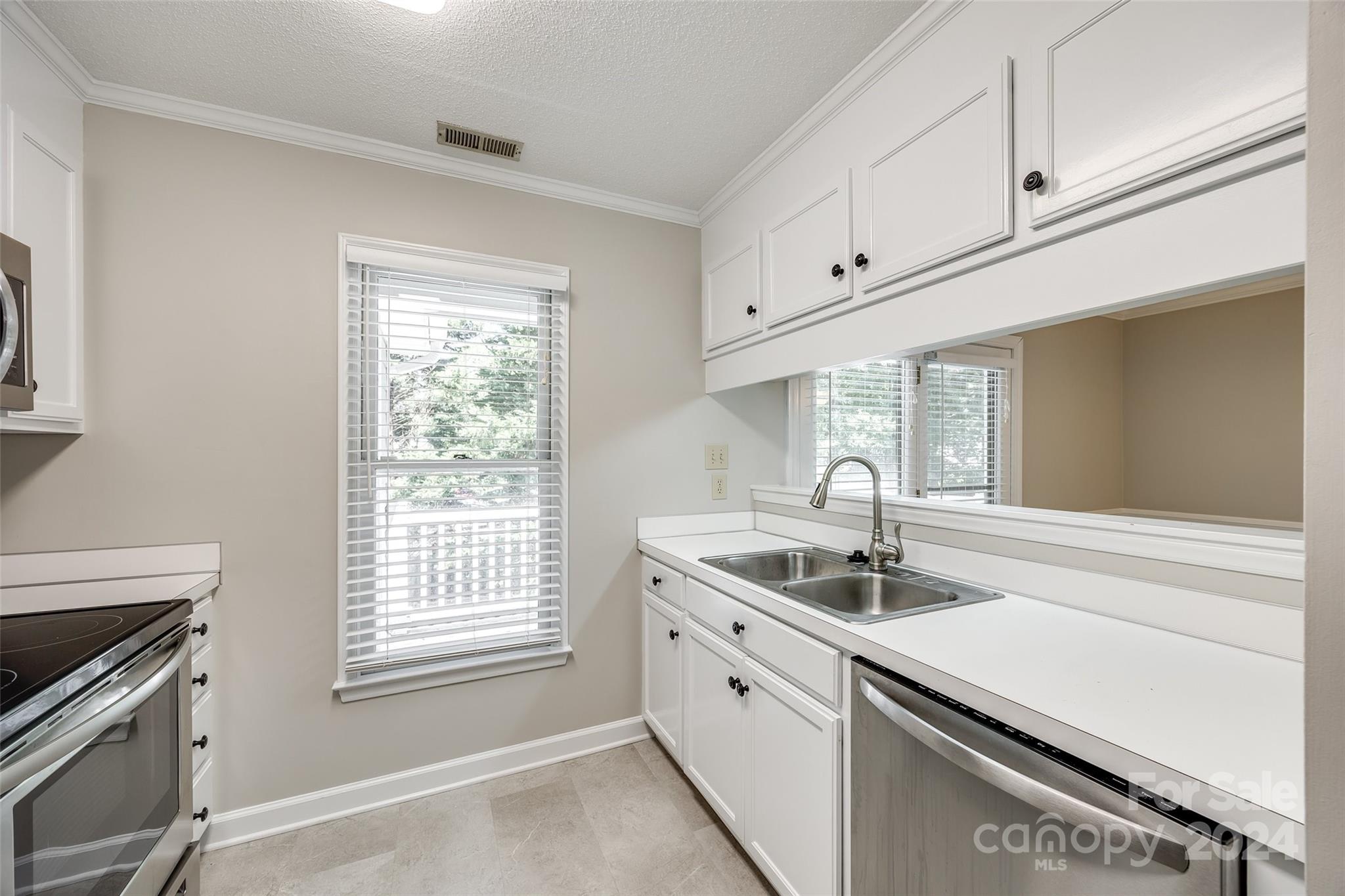 1711 Robinwood Road Gastonia, NC 28054 - Photo 13 of 25 a kitchen with granite countertop a sink and a window
