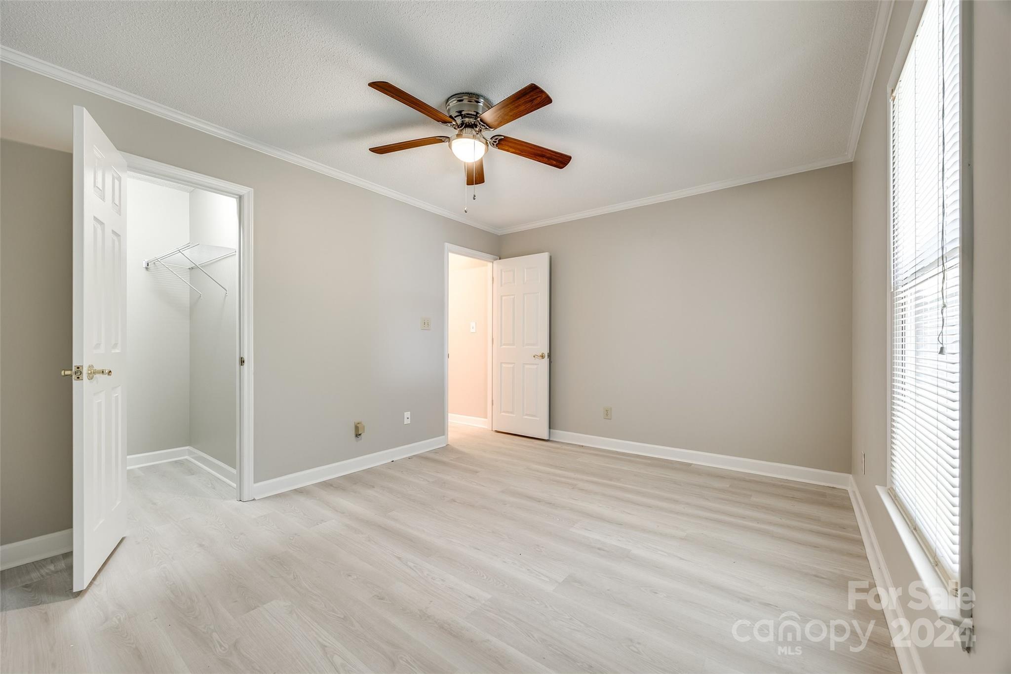 1711 Robinwood Road Gastonia, NC 28054 - Photo 17 of 25 a view of empty room with window and ceiling fan
