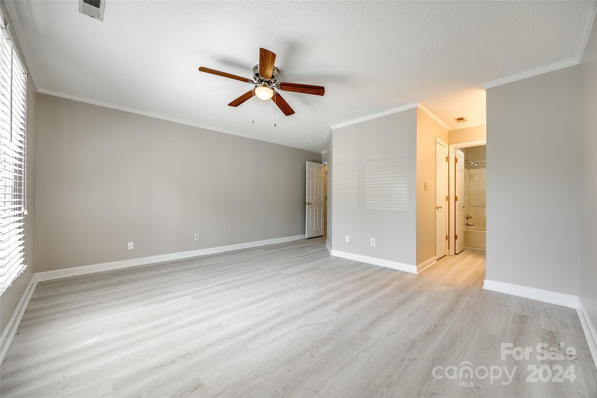 1711 Robinwood Road Gastonia, NC 28054 - Photo 21 of 25 a view of room with wooden floor and windows