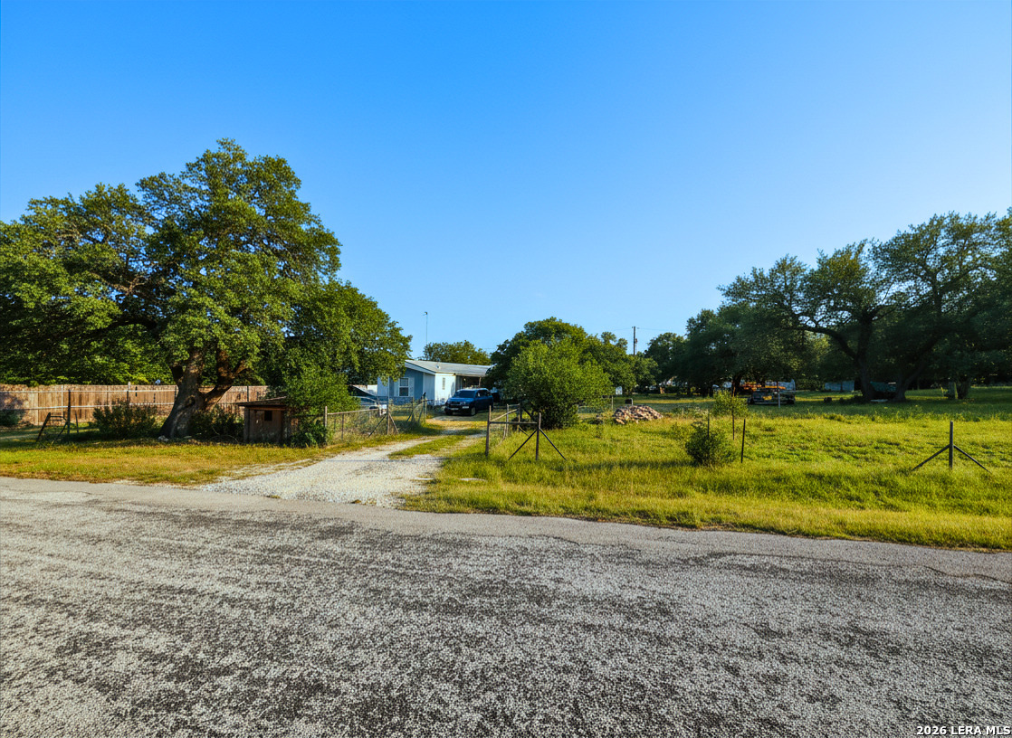 744 Farhills Drive Spring Branch, TX 78070 - Photo 2 of 8 a view of a swimming pool with a yard