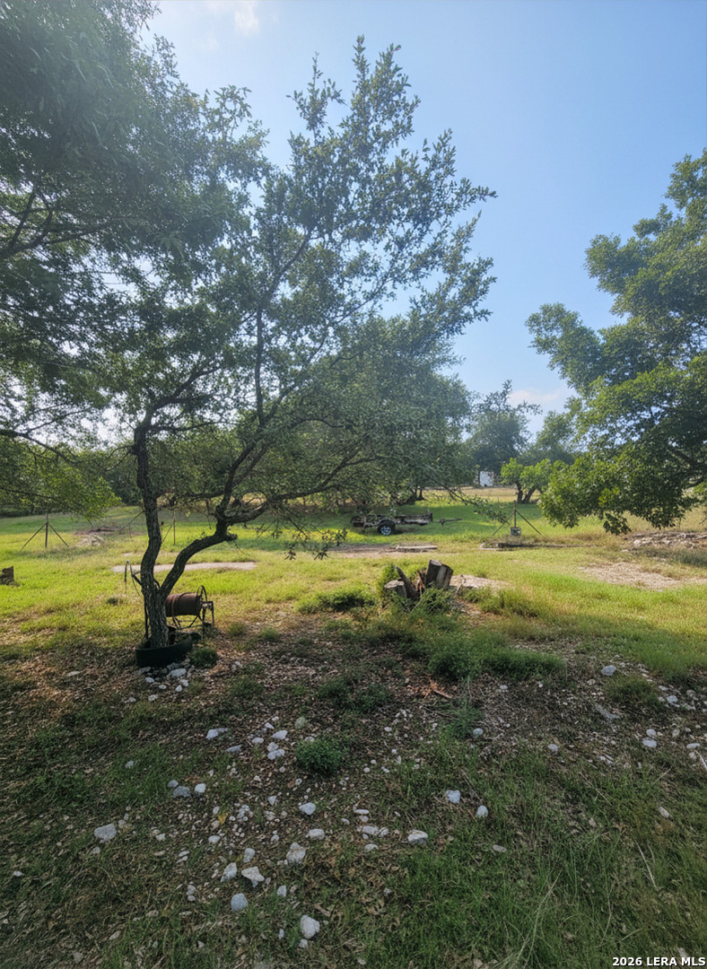 744 Farhills Drive Spring Branch, TX 78070 - Photo 5 of 8 a view of a swimming pool with an outdoor space and seating area