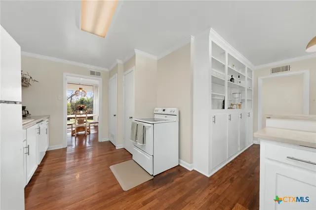 a view of kitchen with furniture and wooden floor