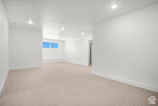 1631 West Century Lane, Unit B Mapleton, UT 84664 - Photo 25 of 33 Empty room with a textured ceiling and light colored carpet