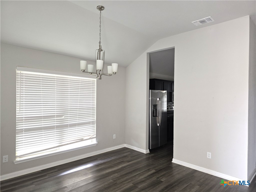 3426 Addison Street Killeen, TX 76542 - Photo 5 of 9 a view of an empty room with wooden floor and a window