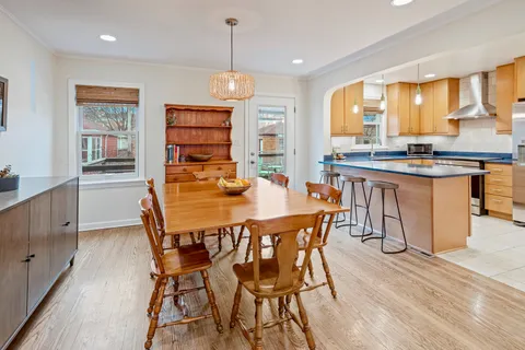 a kitchen with stainless steel appliances granite countertop a sink refrigerator and cabinets