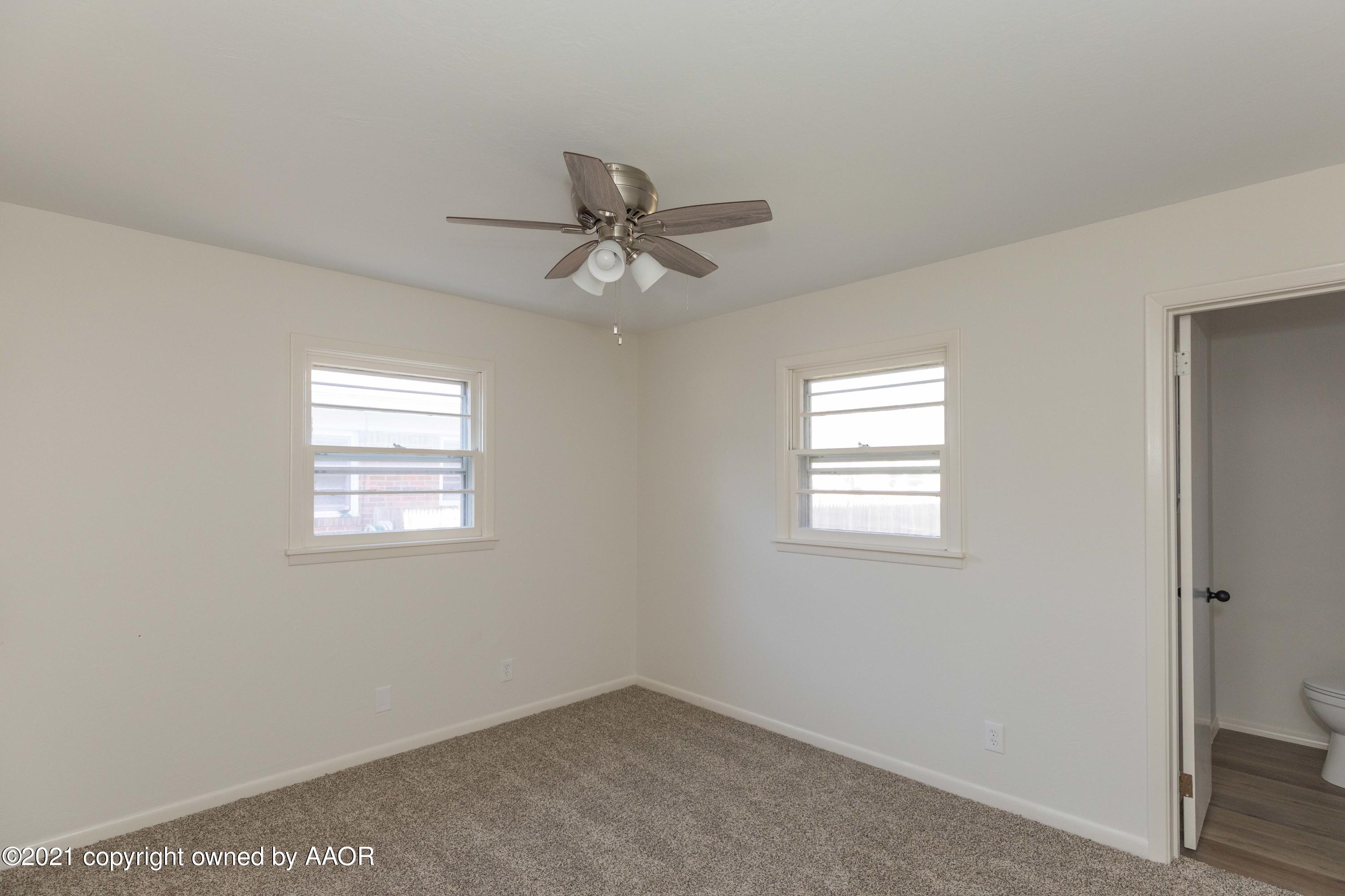 4702 South Rusk Street Amarillo, TX 79110 - Photo 17 of 36 a view of an empty room with a window