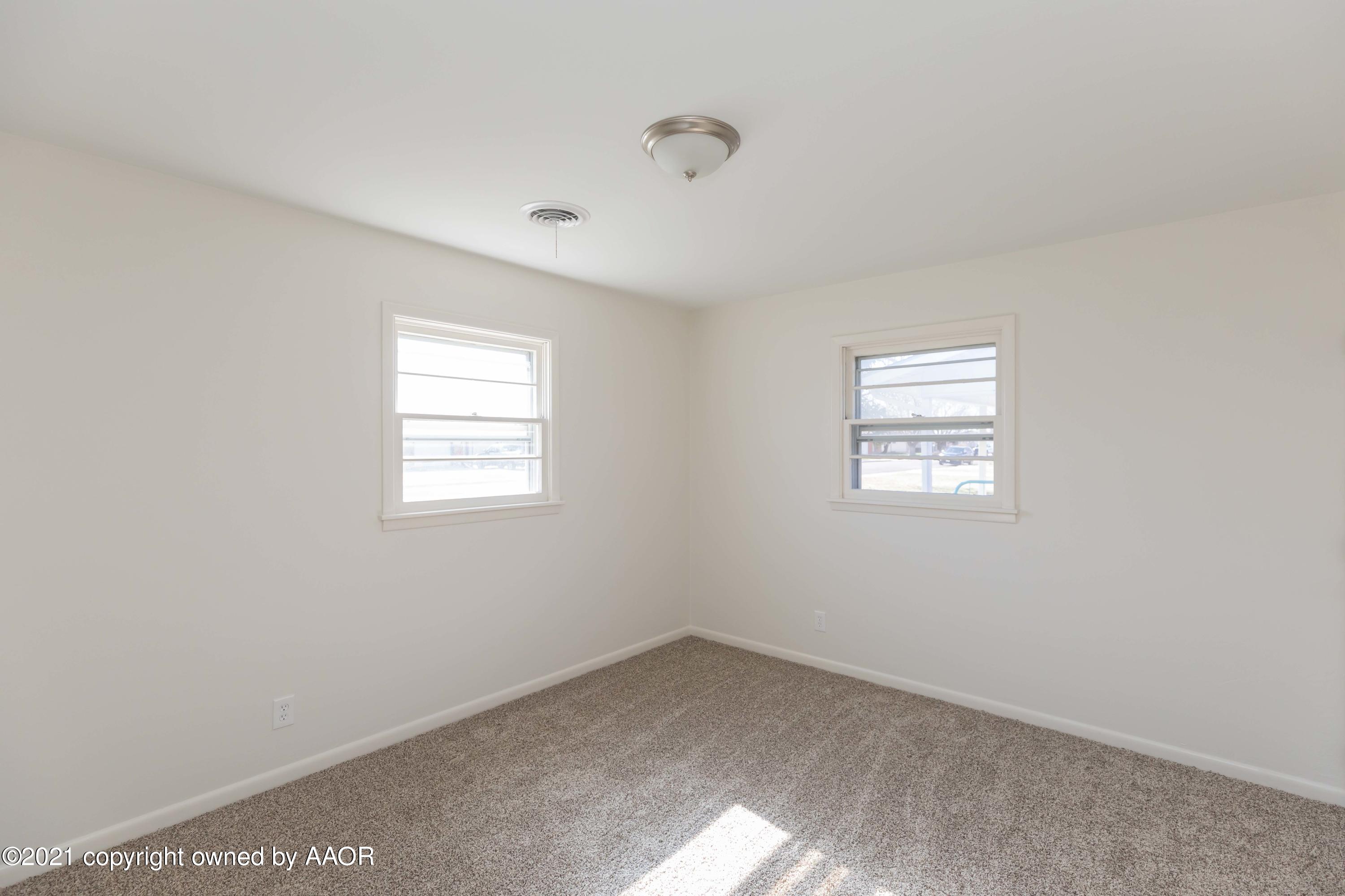 4702 South Rusk Street Amarillo, TX 79110 - Photo 24 of 36 an empty room with a window
