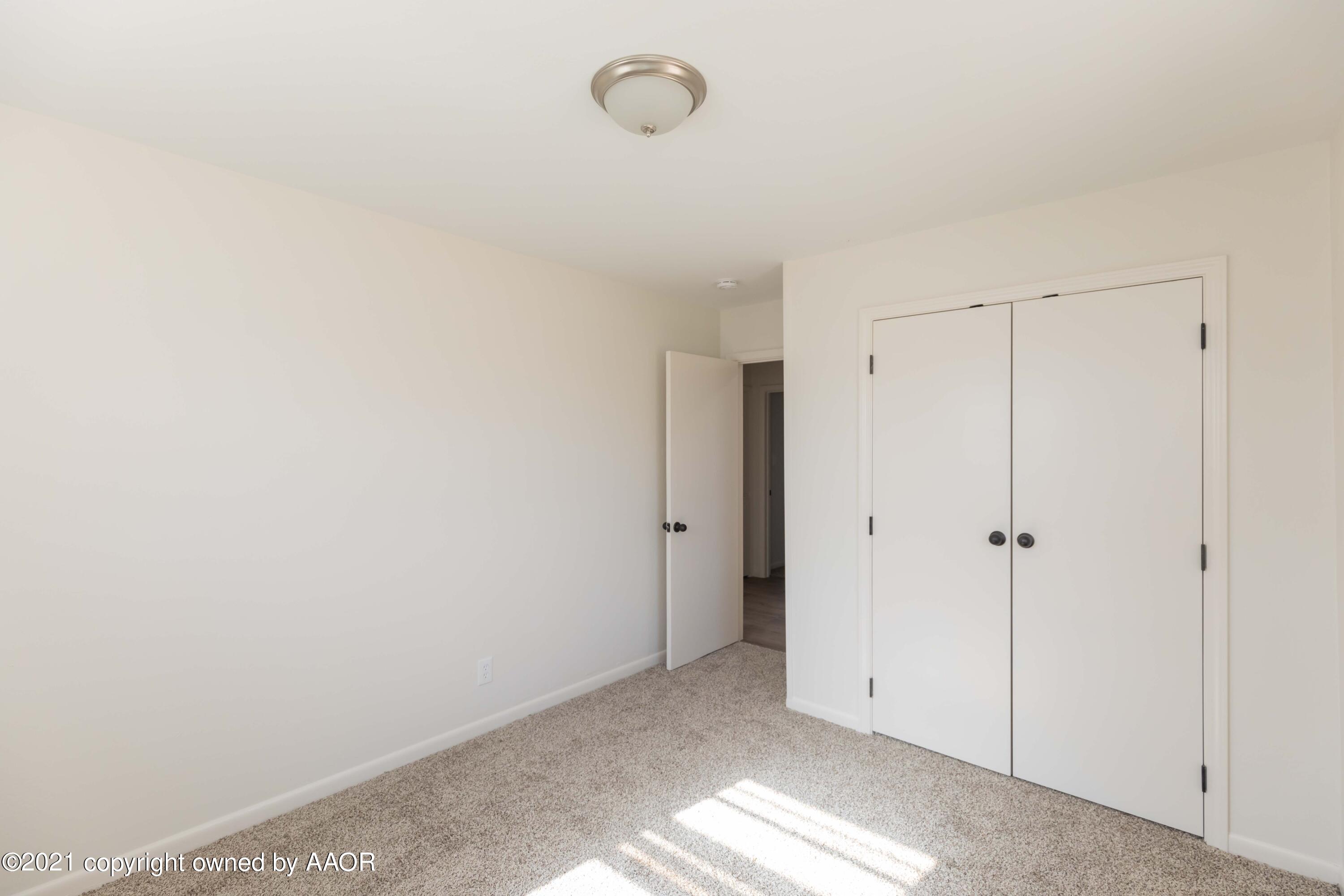 4702 South Rusk Street Amarillo, TX 79110 - Photo 28 of 36 a view of a closet in a room