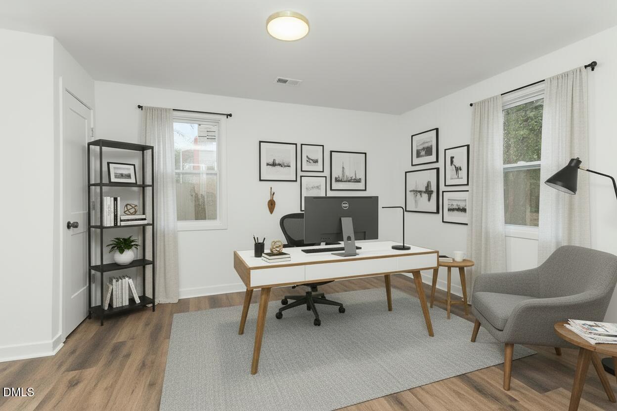 2506 Dominion Street Durham, NC 27704 - Photo 6 of 32 a workspace with furniture and window
