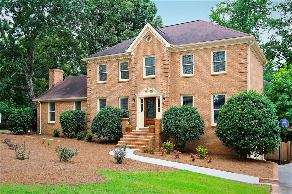 front view of a house with a yard