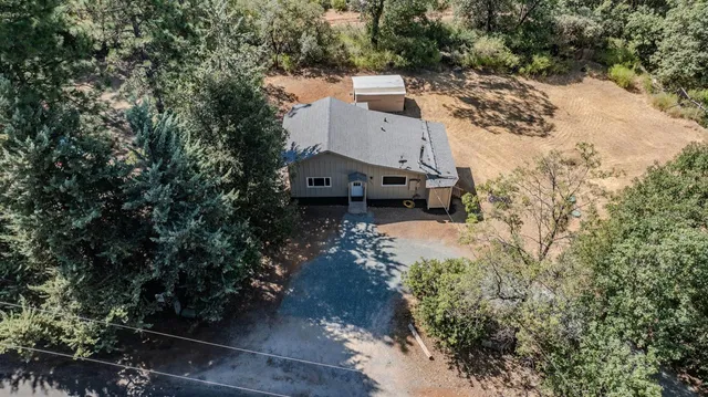 an aerial view of residential house with outdoor space