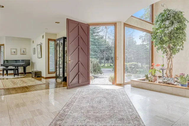 a view of a living room and a large windows