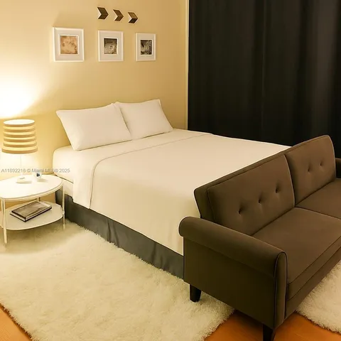 a bedroom with a bed and a couch