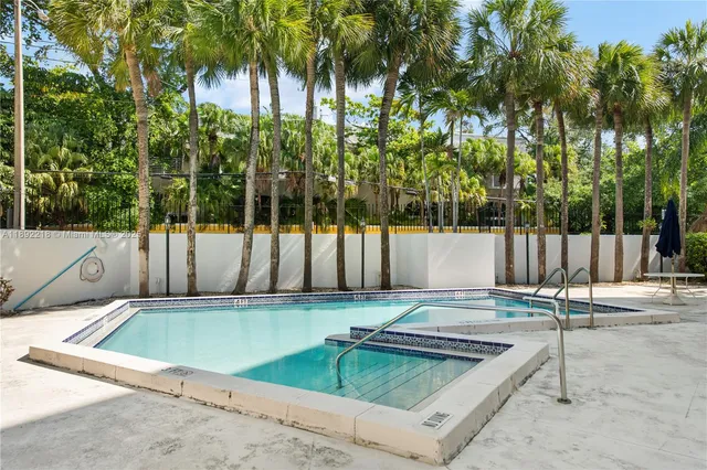 a view of a backyard with swimming pool