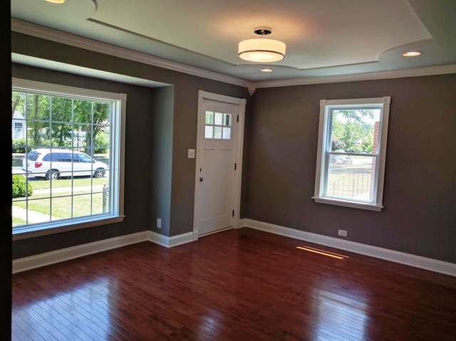 1530 State Line Road Calumet City, IL 60409 - Photo 2 of 16 a view of an empty room with wooden floor and a window