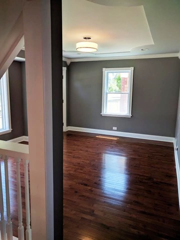 1530 State Line Road Calumet City, IL 60409 - Photo 3 of 16 a view of empty room with wooden floor and fan