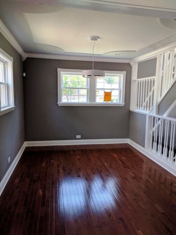 1530 State Line Road Calumet City, IL 60409 - Photo 5 of 16 a view of an empty room with wooden floor and a window