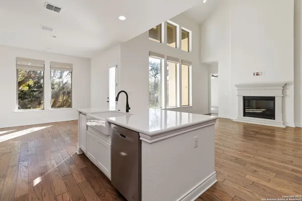 a kitchen with sink and windows