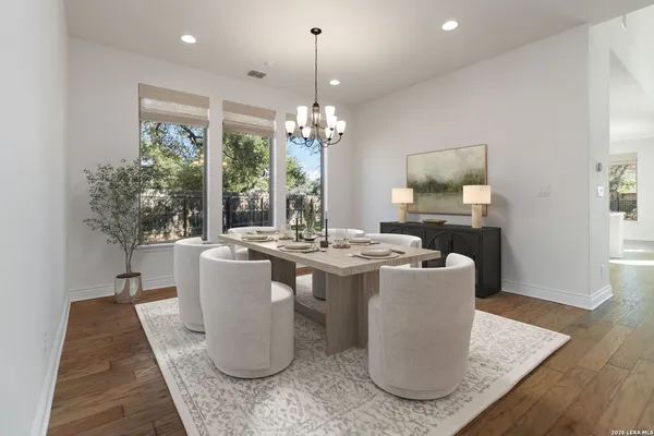 a living room with a couch and a chandelier
