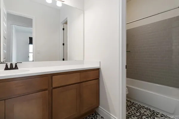 a bathroom with a bathtub and a sink