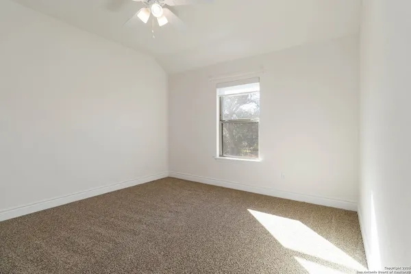 an empty room with a bathroom