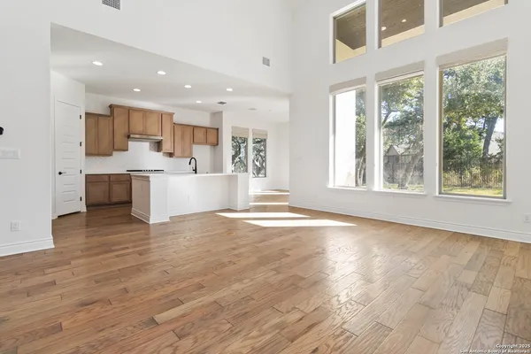 a view of a kitchen with a sink and microwave