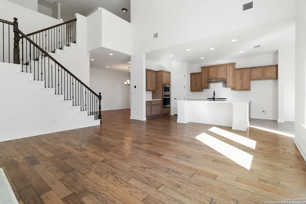 a view of kitchen with cabinets and wooden floor