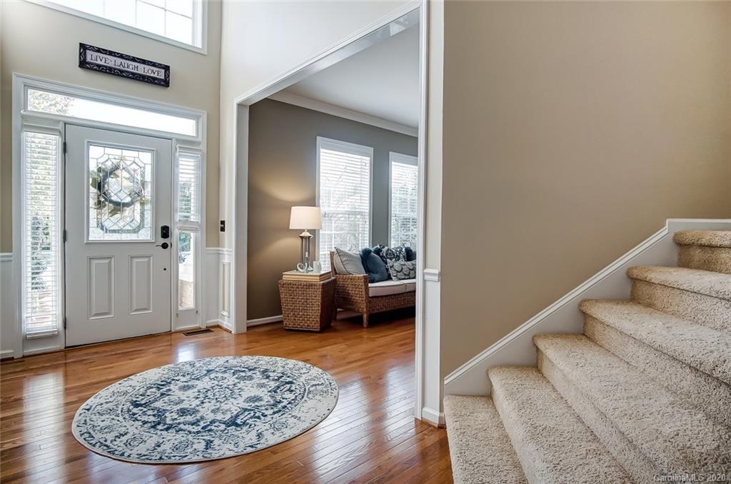 785 Fairway Point Drive Tega Cay, SC 29708 - Photo 2 of 46 a view of a livingroom with wooden floor and a rug