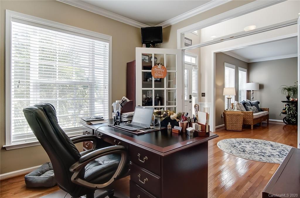 785 Fairway Point Drive Tega Cay, SC 29708 - Photo 18 of 46 a view of a workspace with furniture and a window