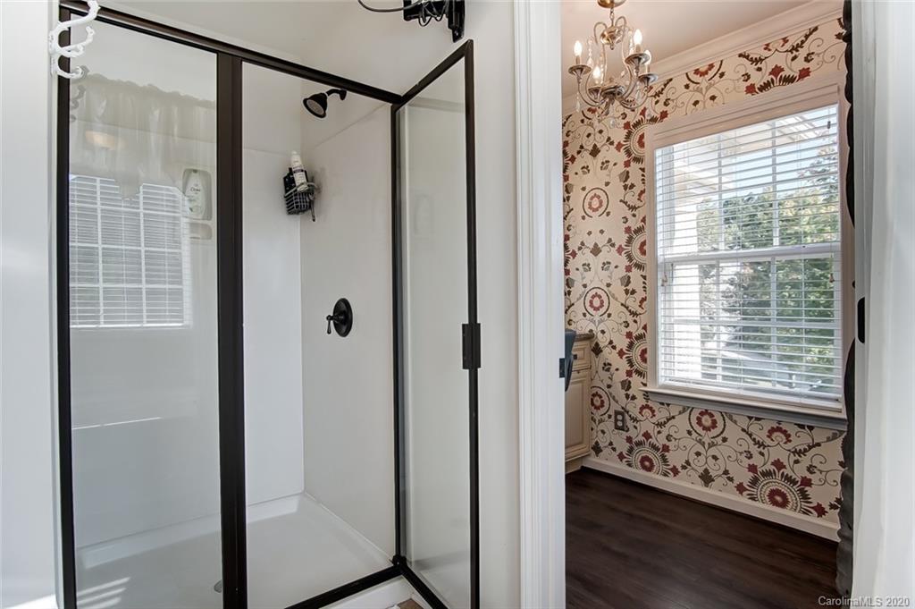 785 Fairway Point Drive Tega Cay, SC 29708 - Photo 24 of 46 a view of a bathroom with a shower and a window